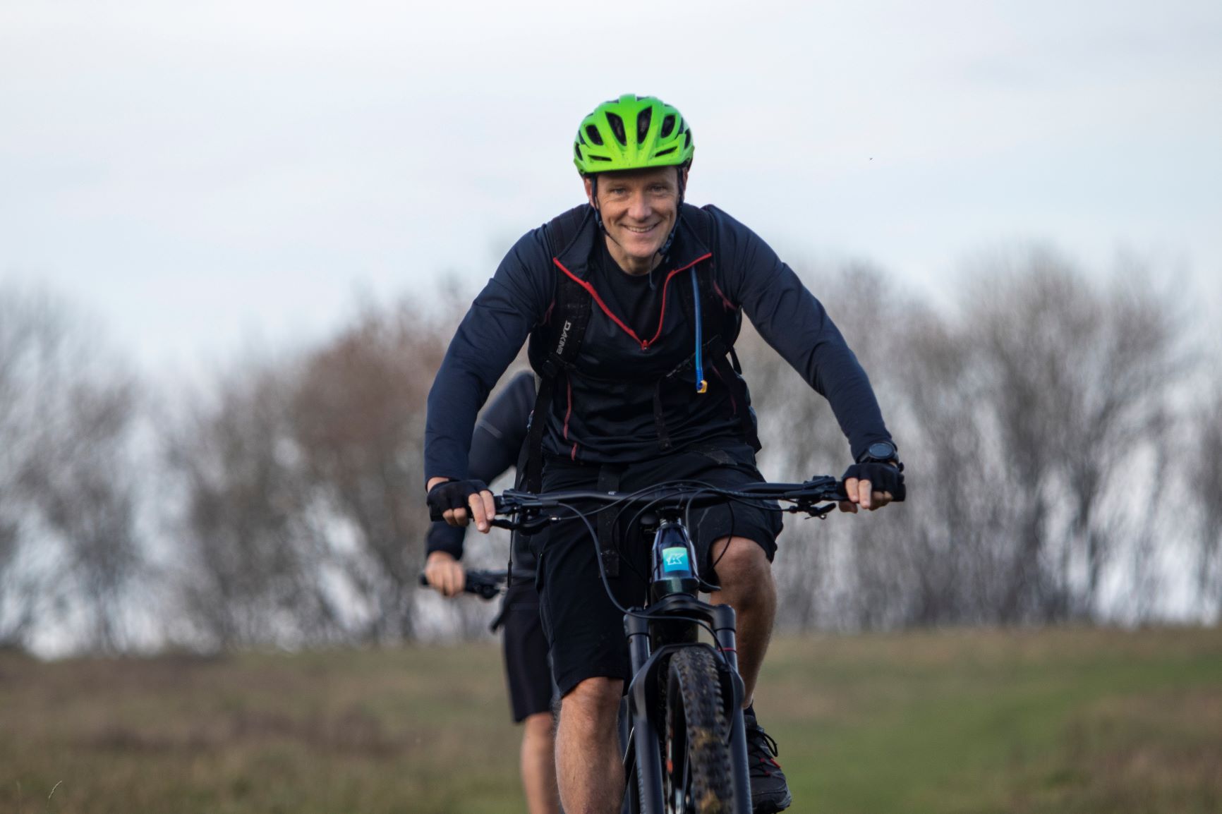 Picture of man riding electric mountain bike