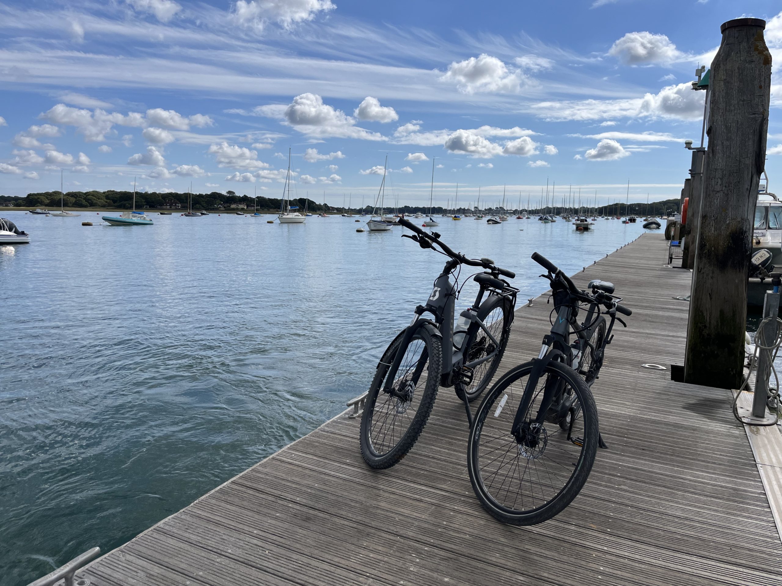 2 electric bikes on the pontoon at Itchenor
